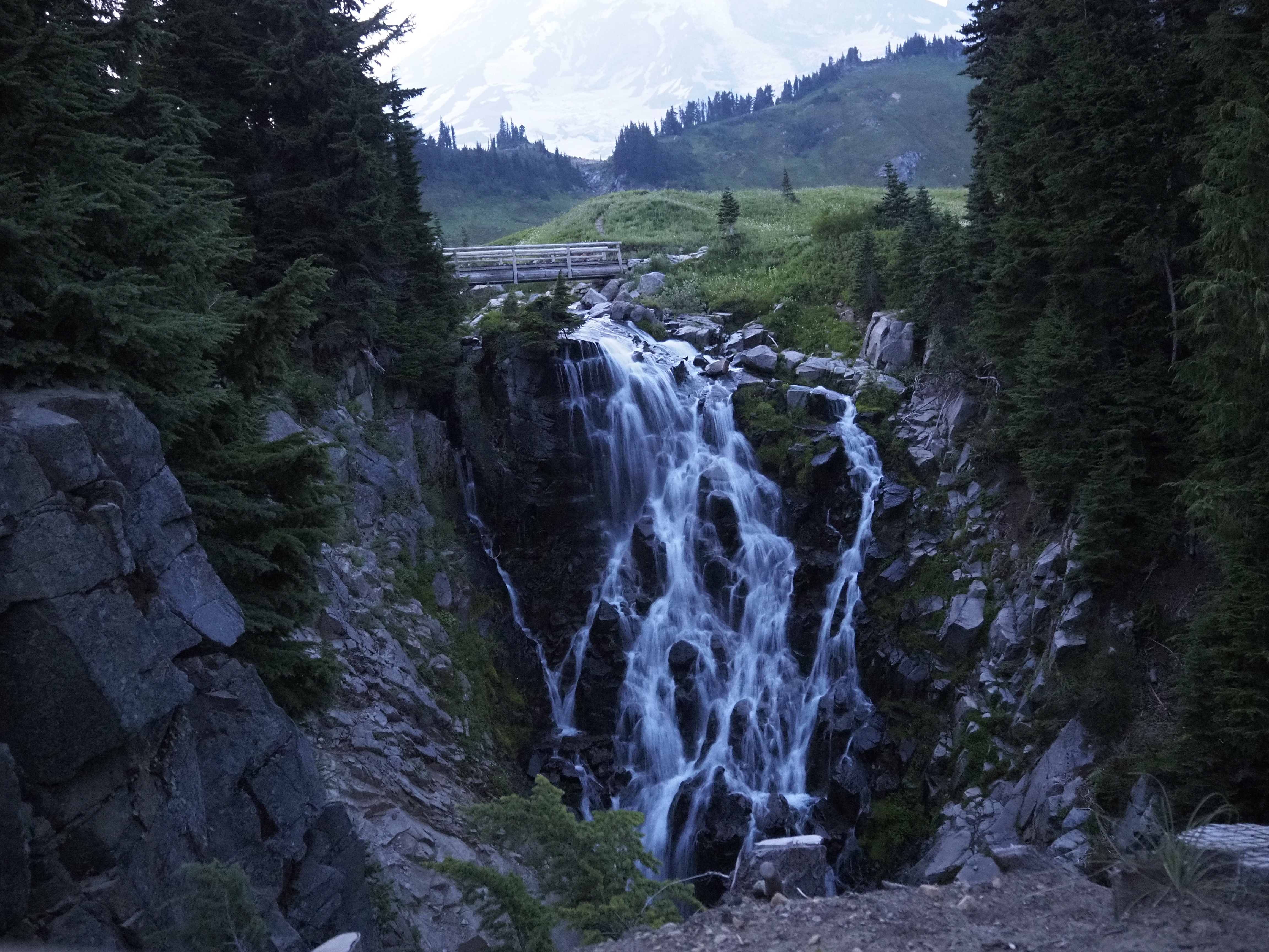 waterfall under mountain